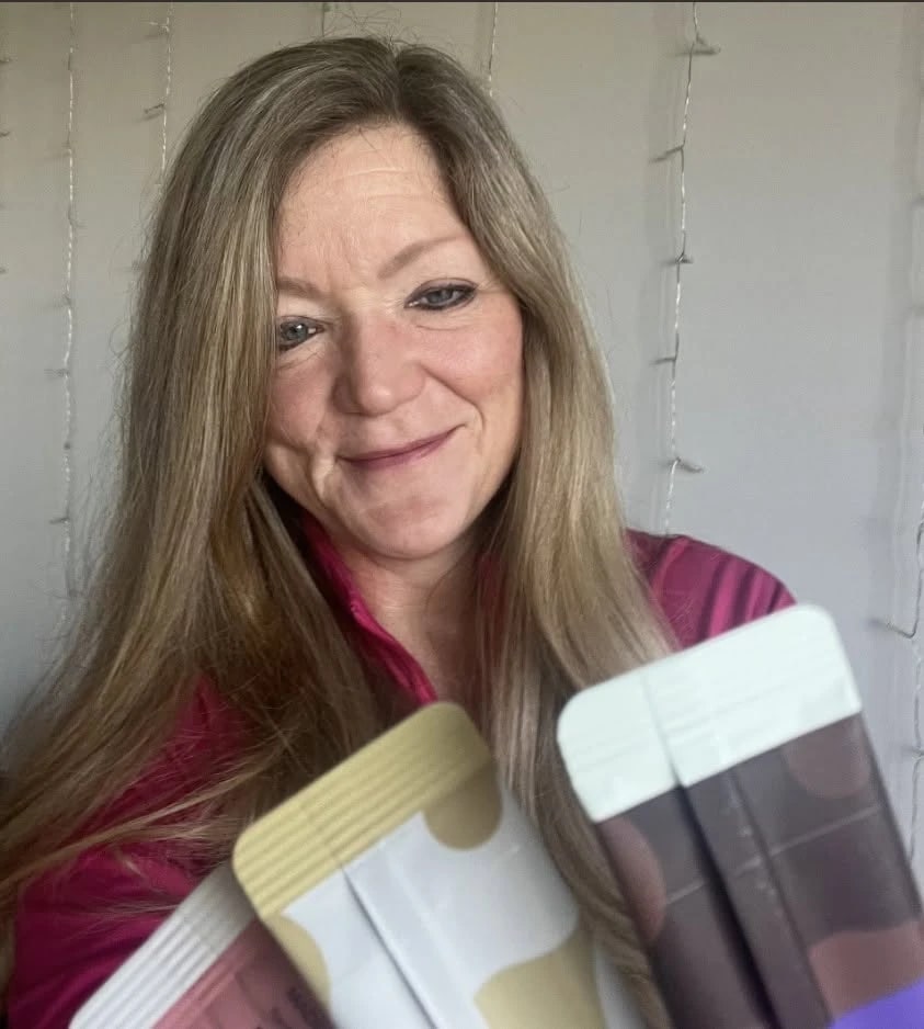 Molly Broad holding Unimate and Balance